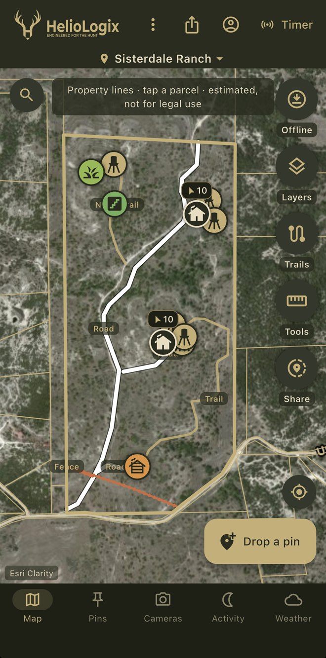 HelioMaps app showing Sisterdale Ranch — property lines, roads, trails, feeder and blind pins on satellite imagery